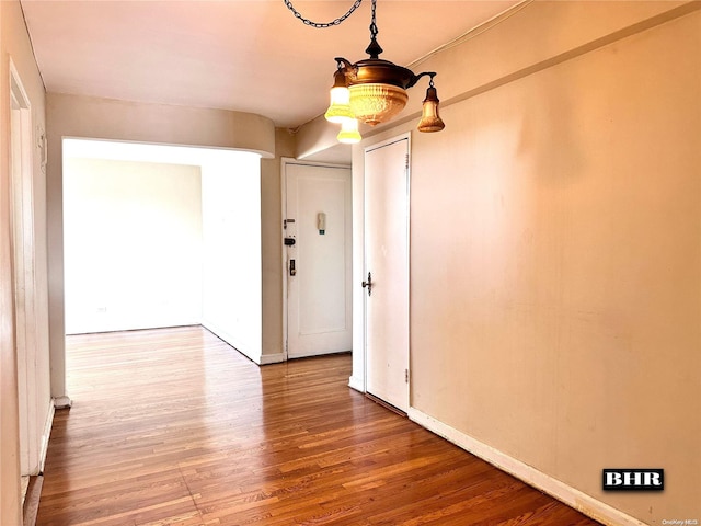 empty room featuring hardwood / wood-style flooring