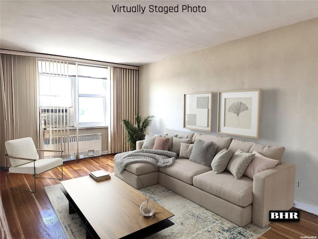 living room featuring radiator heating unit and wood-type flooring