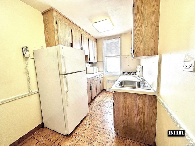 kitchen with white appliances and sink