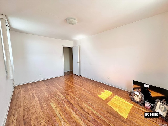 spare room featuring light hardwood / wood-style flooring