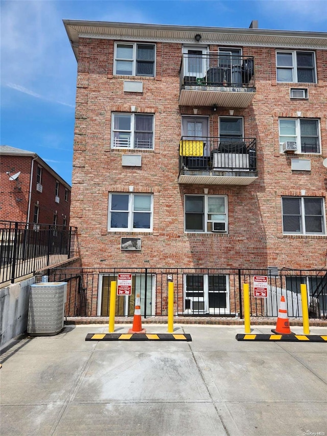 view of building exterior with central AC unit