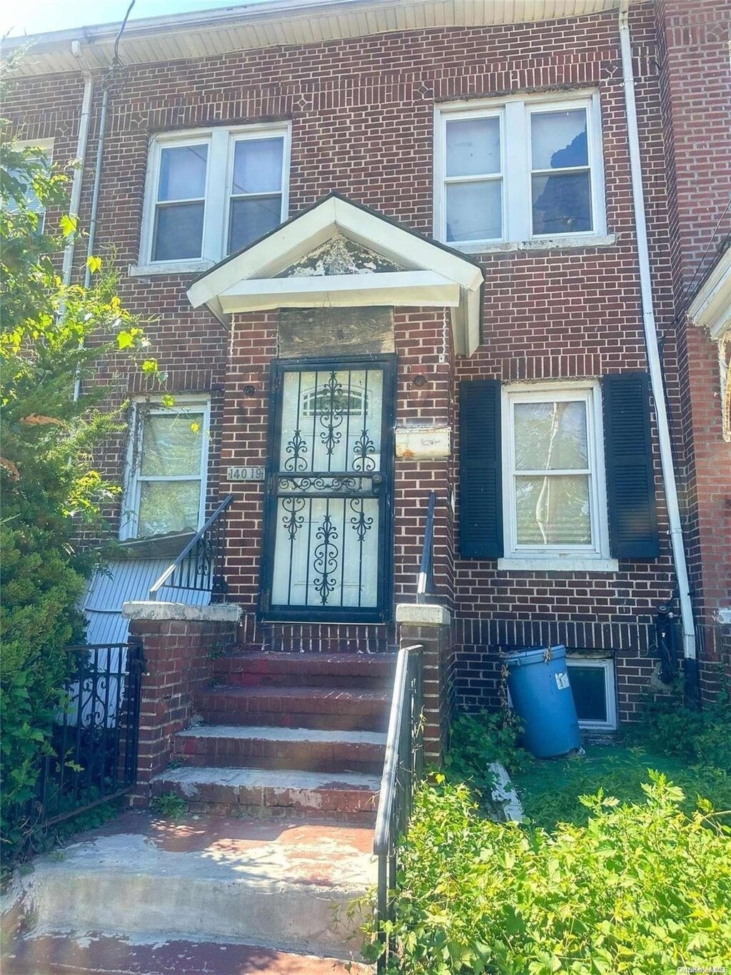 140-19 Rose Ave, Flushing, NY 11355 - doorway to property with brick siding