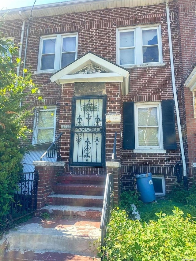140-19 Rose Ave, Flushing, NY 11355 - doorway to property with brick siding