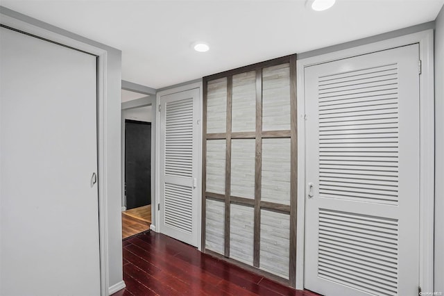 hall with dark hardwood / wood-style floors