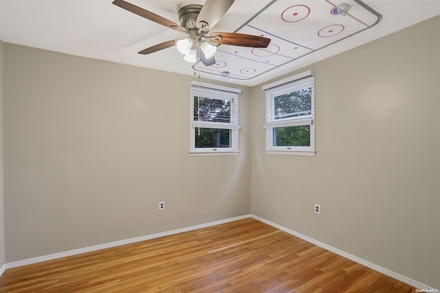 unfurnished room featuring ceiling fan and light hardwood / wood-style floors