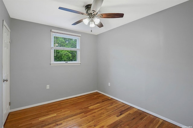 unfurnished room featuring ceiling fan and hardwood / wood-style flooring