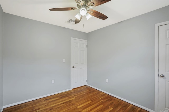 empty room featuring hardwood / wood-style floors and ceiling fan