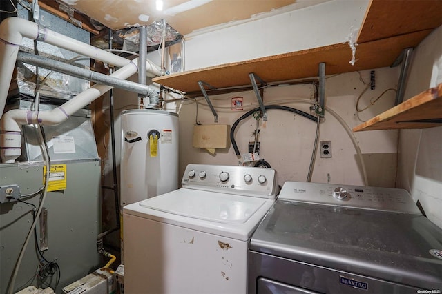 clothes washing area with washer hookup, gas water heater, and heating unit