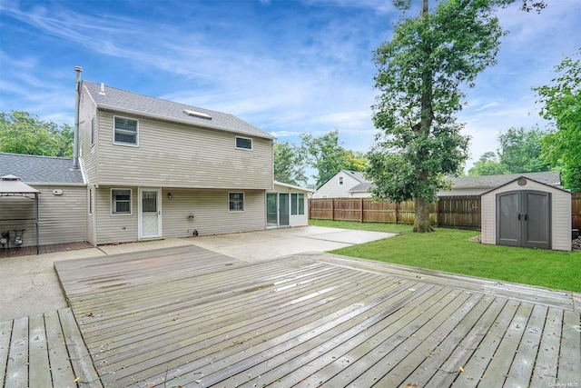 deck with a yard and a storage shed