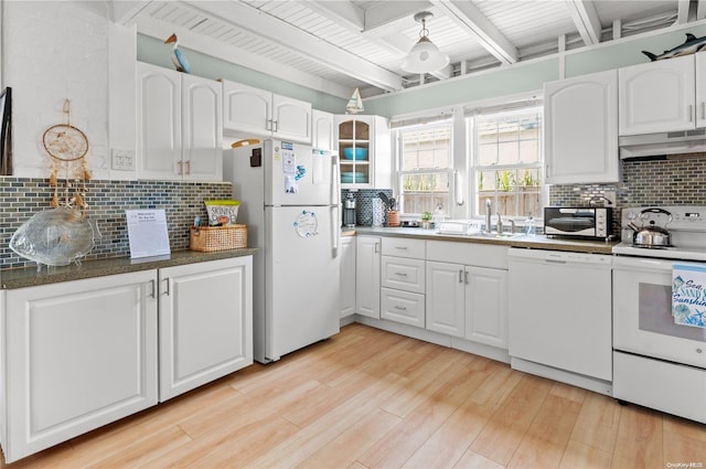 kitchen with beam ceiling, white cabinetry, tasteful backsplash, white appliances, and light wood-type flooring