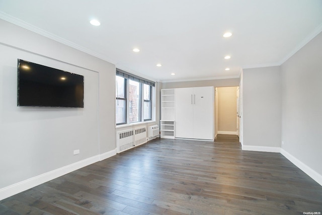 unfurnished living room with crown molding, radiator heating unit, and dark wood-type flooring