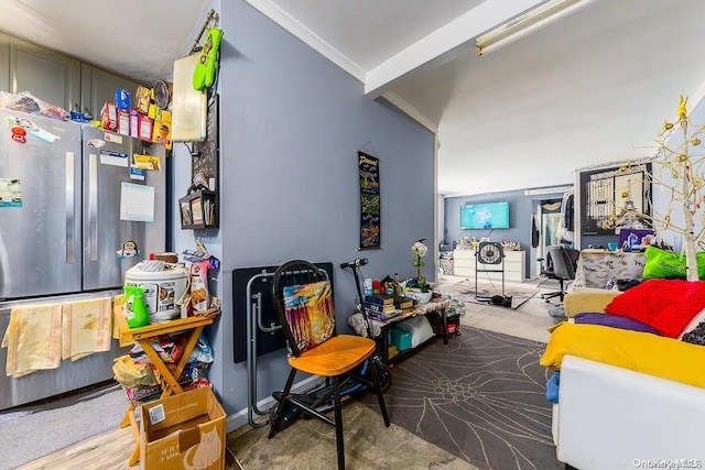 interior space featuring hardwood / wood-style flooring and ornamental molding