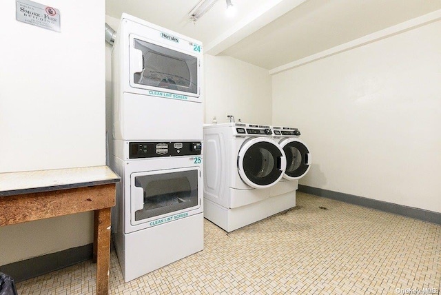 laundry room with washer and dryer and stacked washing maching and dryer