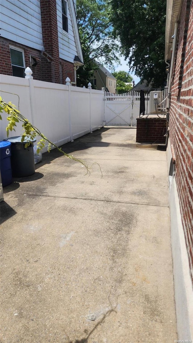 48-27 213th St, Bayside, NY 11364 - view of patio featuring a gate