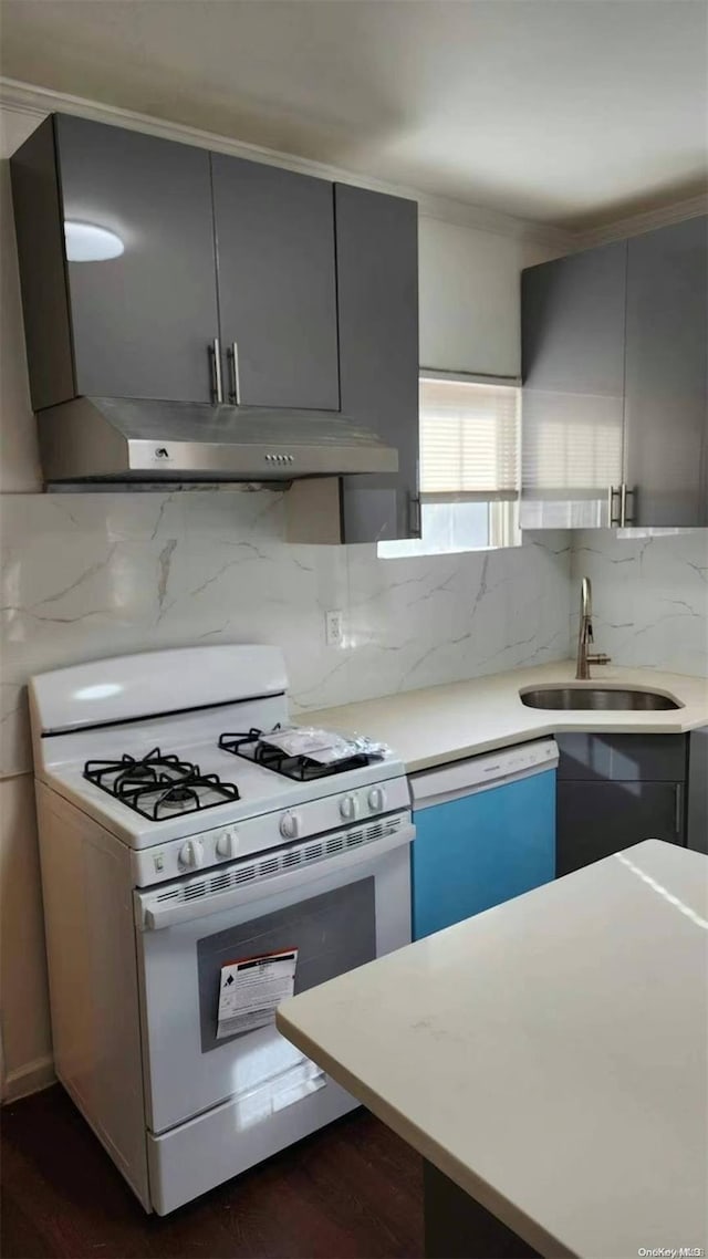 48-27 213th St, Bayside, NY 11364 - kitchen with white appliances, under cabinet range hood, light countertops, gray cabinets, and crown molding