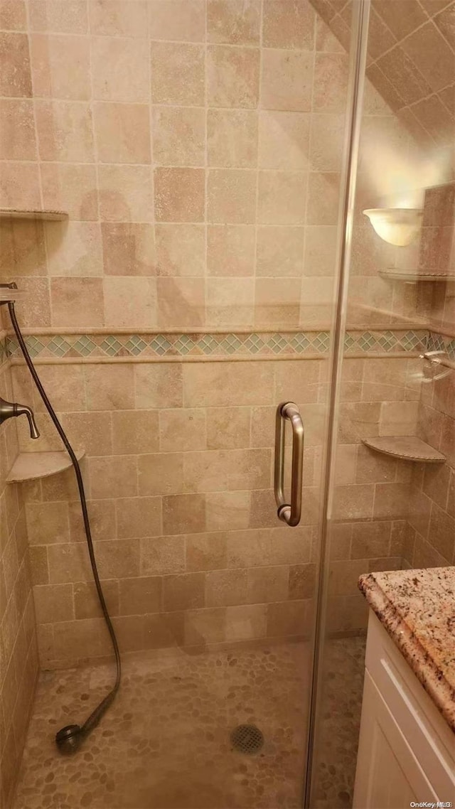 bathroom with an enclosed shower