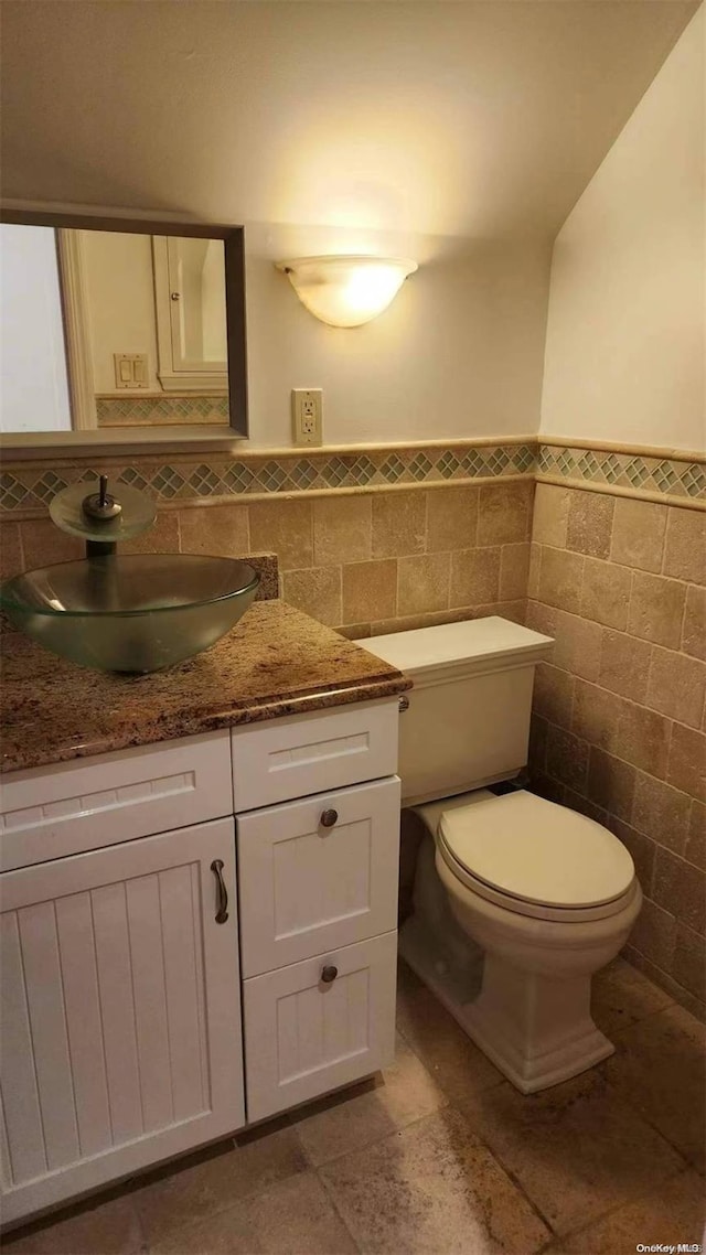 48-27 213th St, Bayside, NY 11364 - half bath with tile walls, vanity, and a wainscoted wall