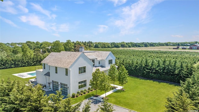 birds eye view of property with a rural view