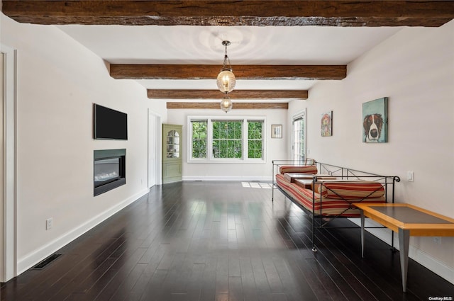 playroom featuring beam ceiling and dark wood-type flooring