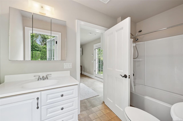 full bathroom featuring vanity, tile patterned floors, shower / bathtub combination, and a healthy amount of sunlight