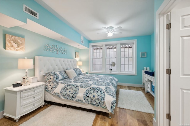 bedroom with ceiling fan and light wood-type flooring