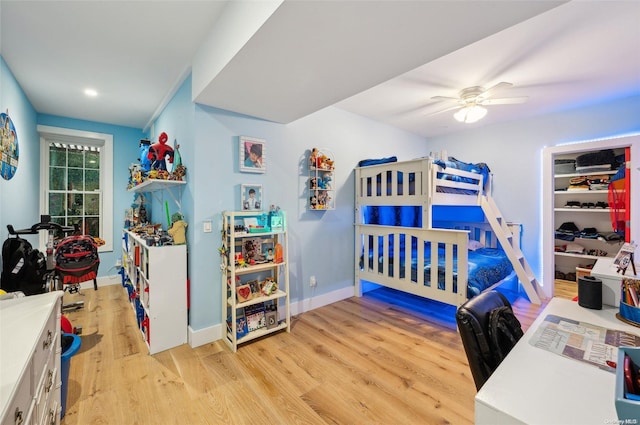 bedroom featuring light wood-type flooring and ceiling fan