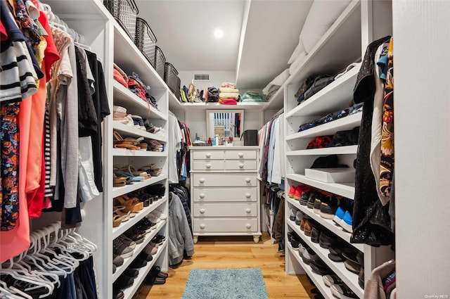 walk in closet featuring light hardwood / wood-style floors