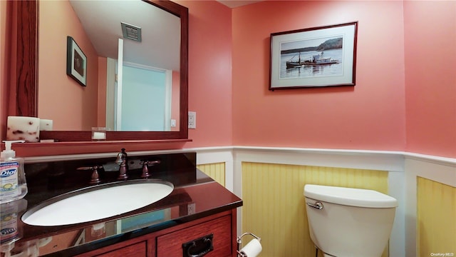 bathroom with vanity and toilet