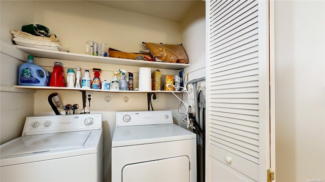 clothes washing area featuring separate washer and dryer