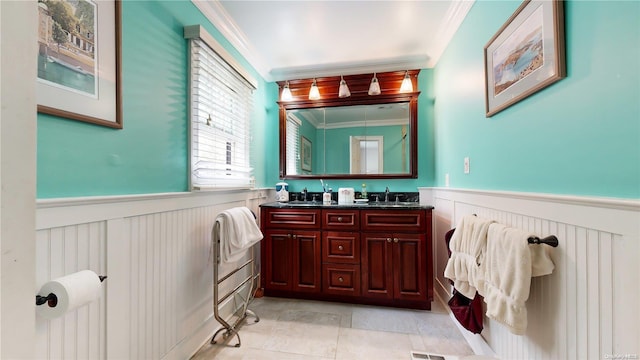 bathroom featuring vanity and crown molding