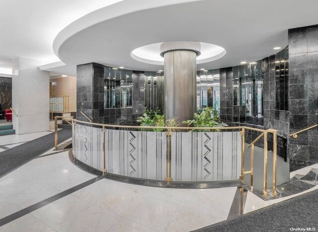 reception area featuring ornate columns