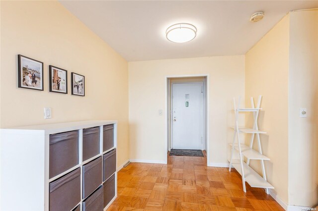 hallway with light parquet floors