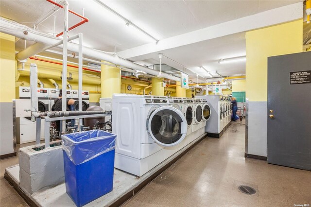 laundry area with washing machine and clothes dryer