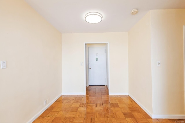 corridor with light parquet floors