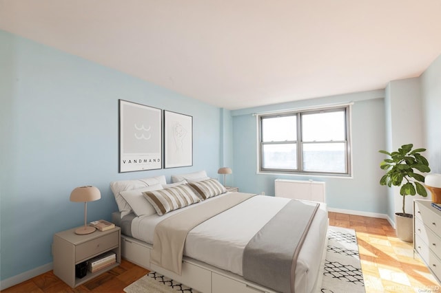 bedroom featuring light parquet flooring