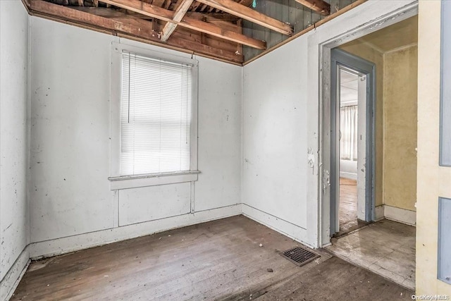 unfurnished room with dark hardwood / wood-style floors