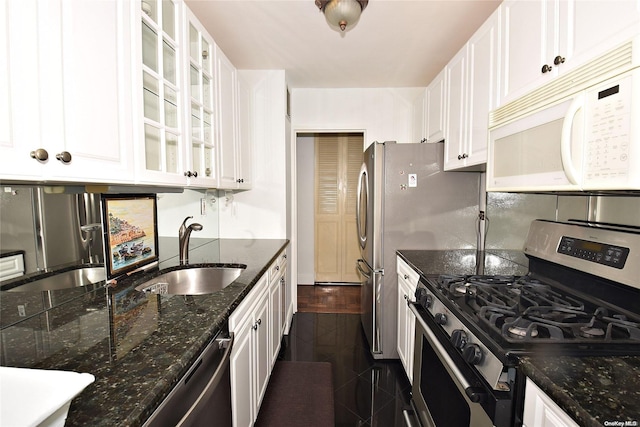 kitchen with white cabinets, dark hardwood / wood-style flooring, stainless steel appliances, and sink