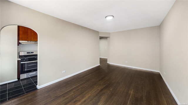35-38 75th St Unit 4C, Jackson Heights, NY 11372 - empty room featuring dark wood-type flooring and arched walkways