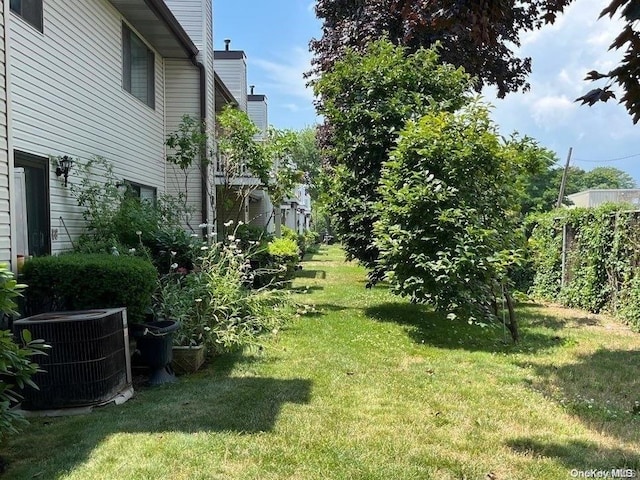 view of yard with central AC unit