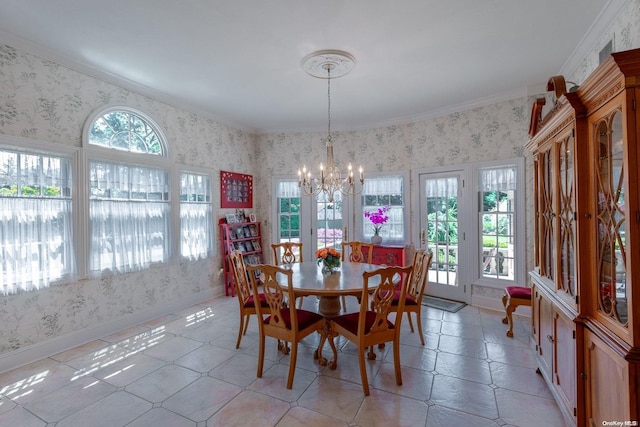 dining area with crown molding, a wealth of natural light, and a notable chandelier