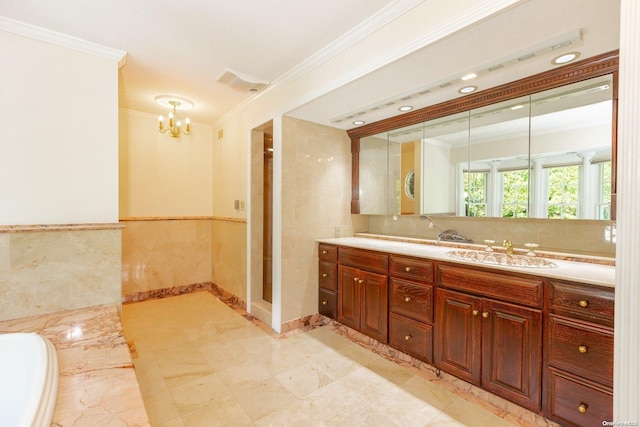 bathroom with vanity, tile walls, crown molding, and a notable chandelier