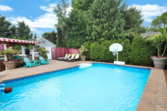 view of swimming pool featuring a patio