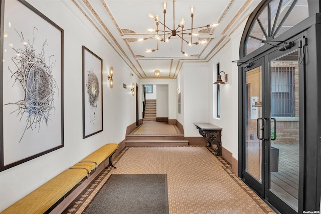 corridor with plenty of natural light, carpet floors, french doors, and ornamental molding