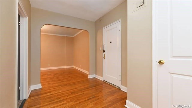 63-60 102nd St Unit D9, Rego Park, NY 11374 - hall featuring light wood-style flooring and arched walkways