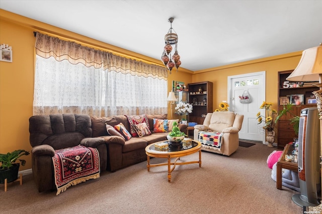 living room featuring carpet and crown molding