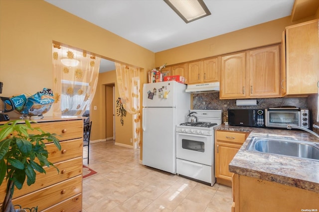 kitchen featuring light brown cabinetry, white appliances, backsplash, and sink