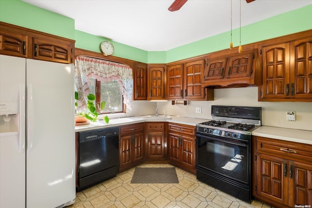 kitchen with black appliances, ceiling fan, and sink