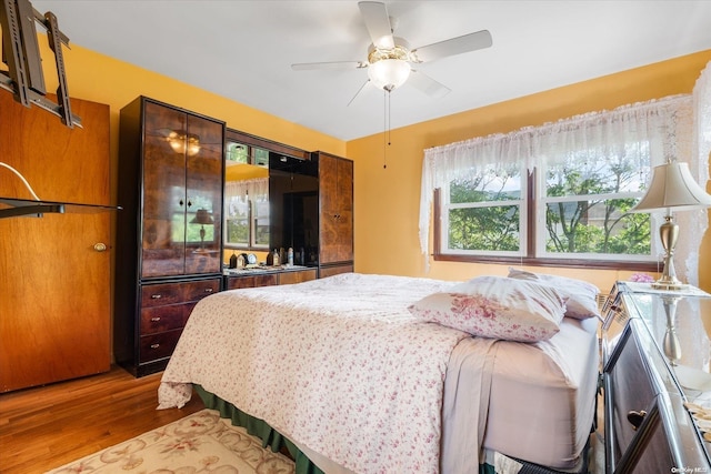 bedroom featuring light hardwood / wood-style flooring and ceiling fan