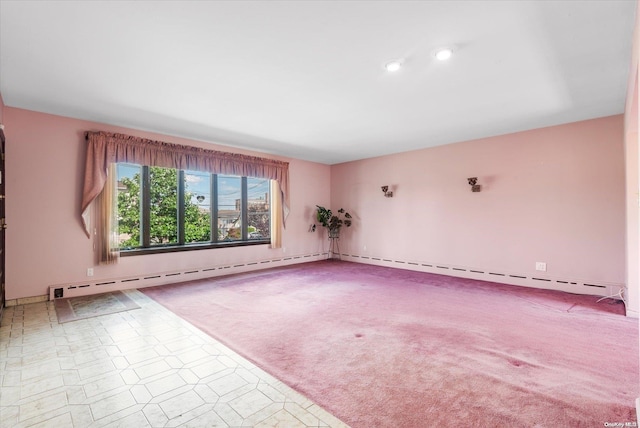 carpeted empty room with a baseboard radiator