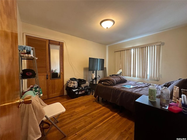 bedroom with hardwood / wood-style floors